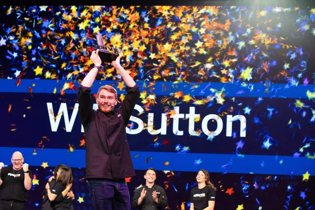 Will Sutton holding the Iron Viz 2022 trophy